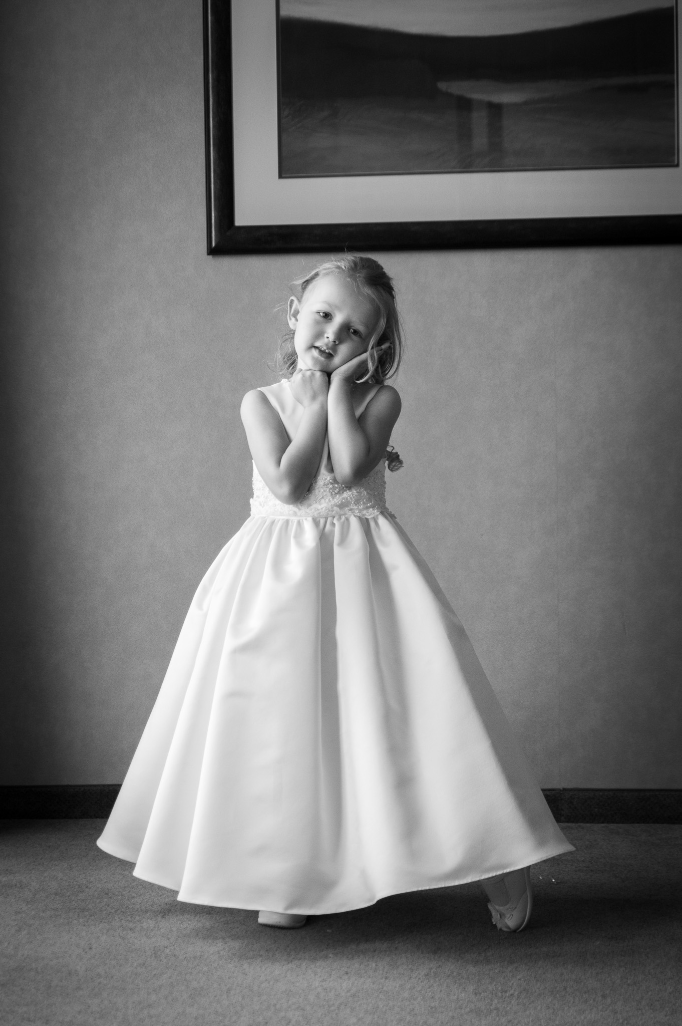 Flower girl looking at camera in black and white