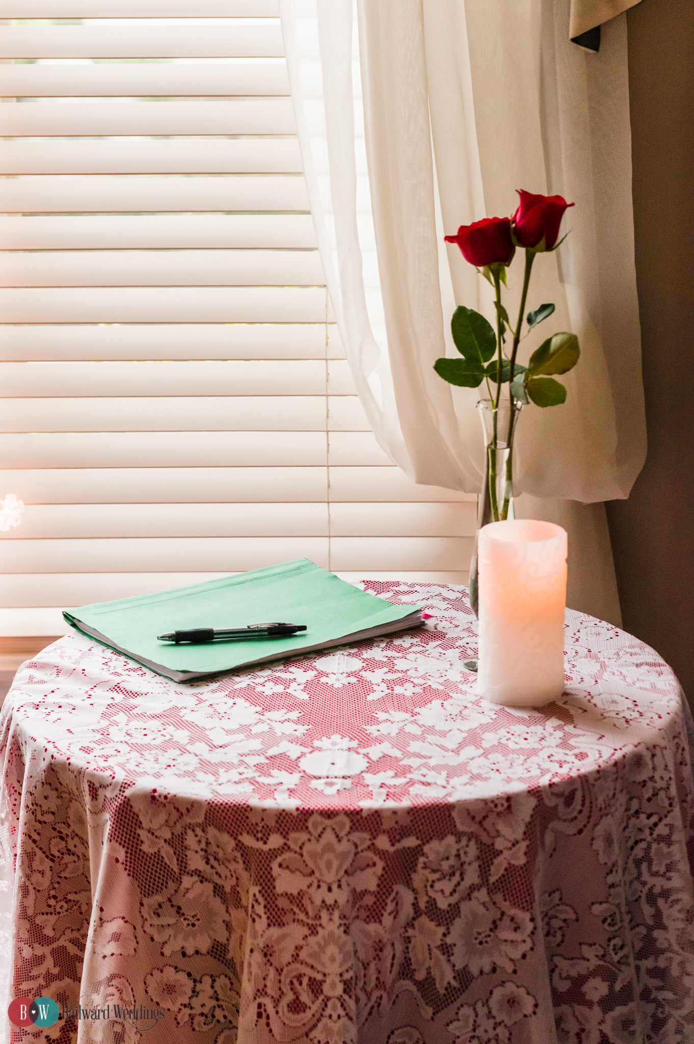 Rose on marriage paperwork signing table