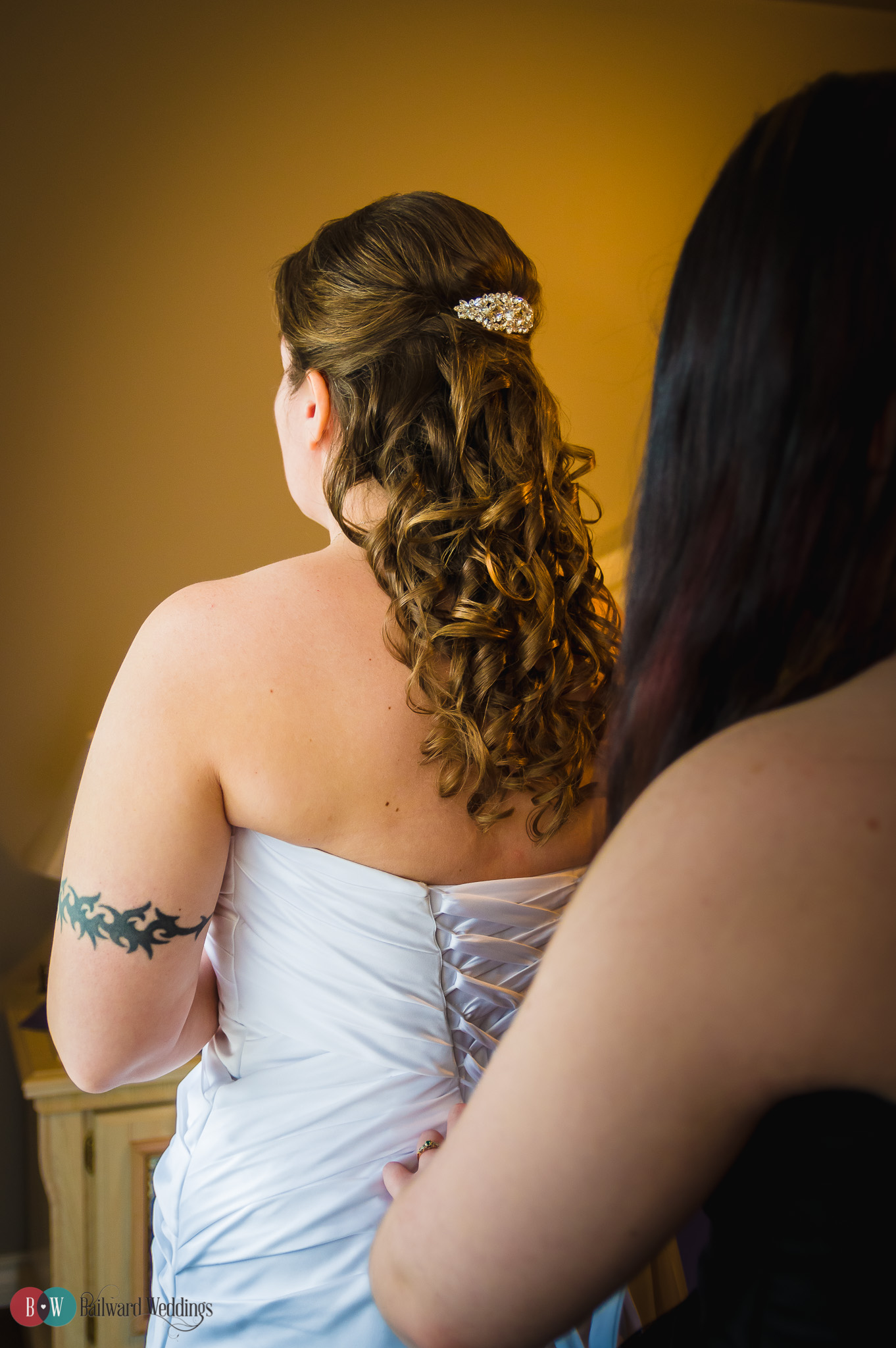 Bride getting ready from behind