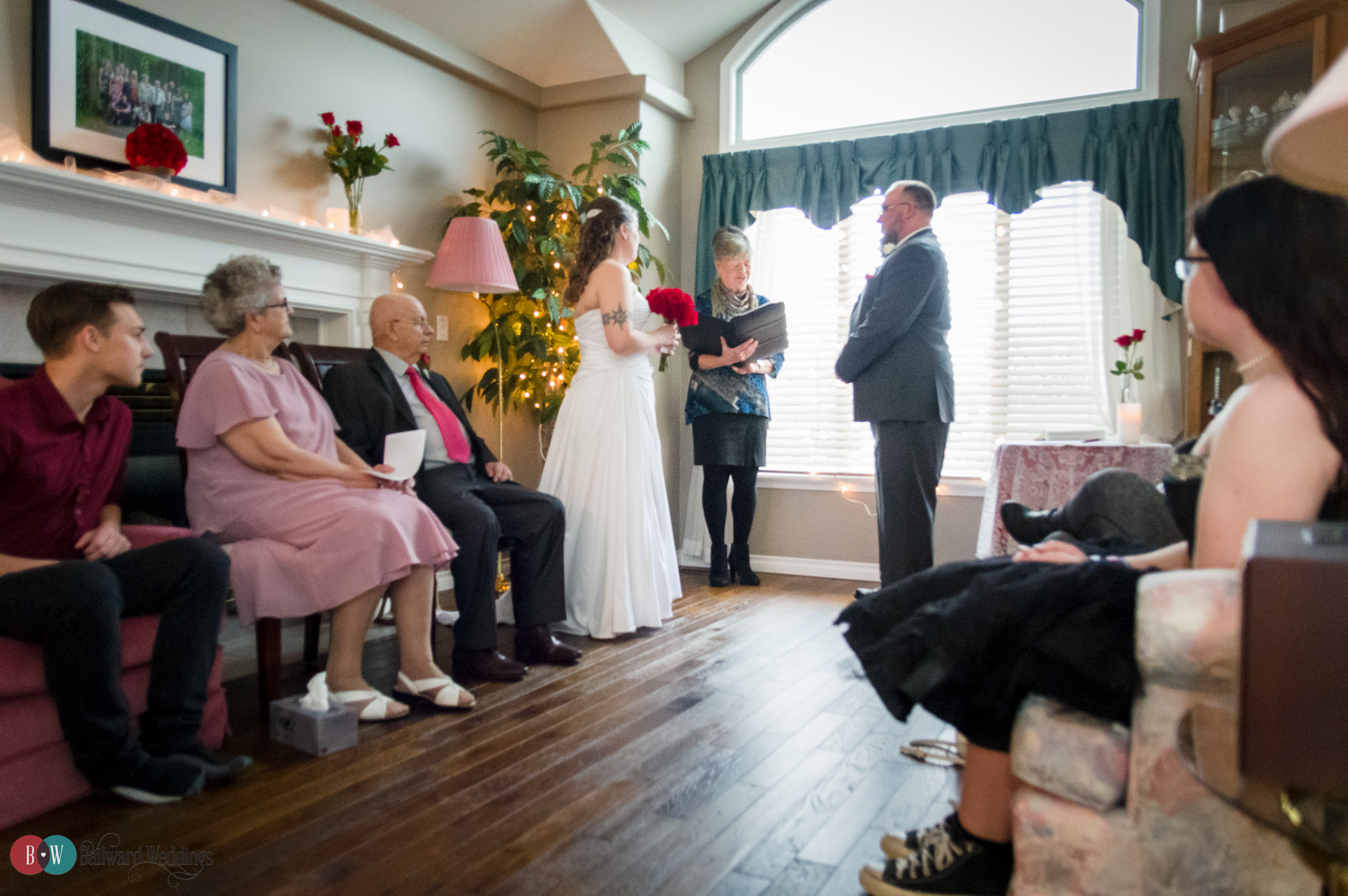 Home ceremony with bride and groom standing