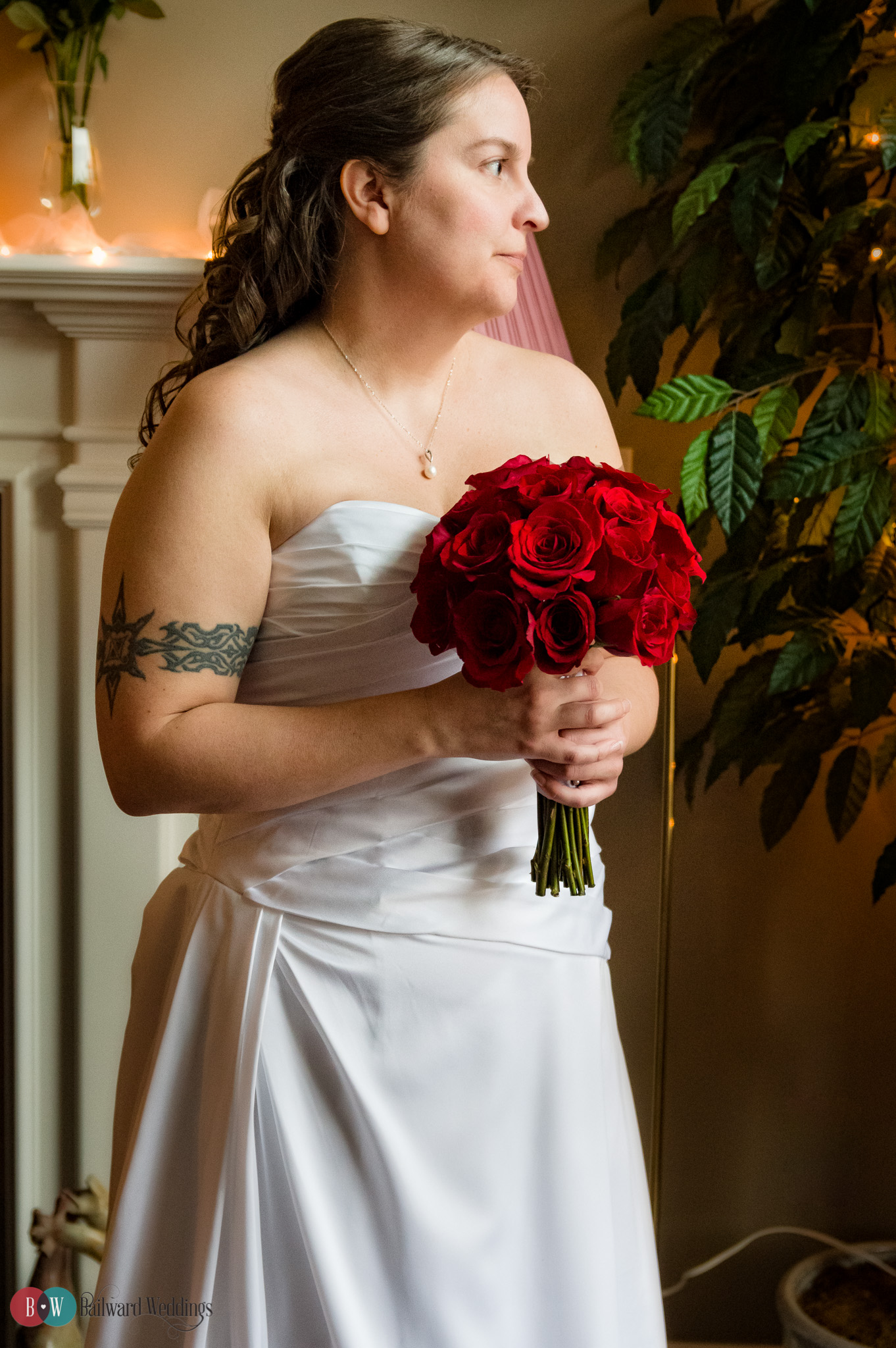 Bride in ceremony with red flowers
