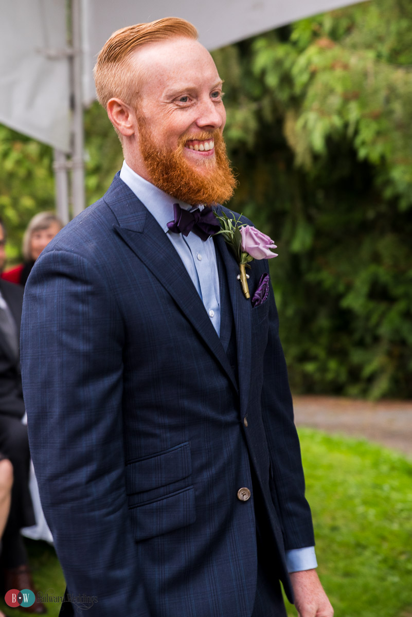 Groom smiling before the ceremony
