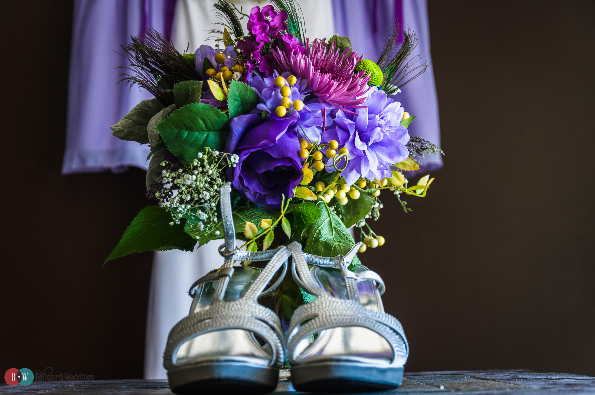 Wedding details - high heels in front of flowers and purple dresses in Coquitlam