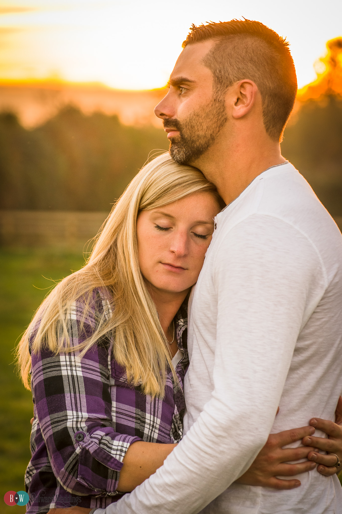 Engagement couple against sunset