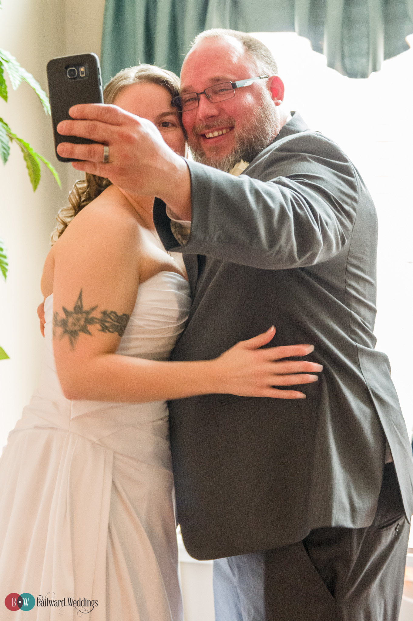 Bride and groom taking selfie