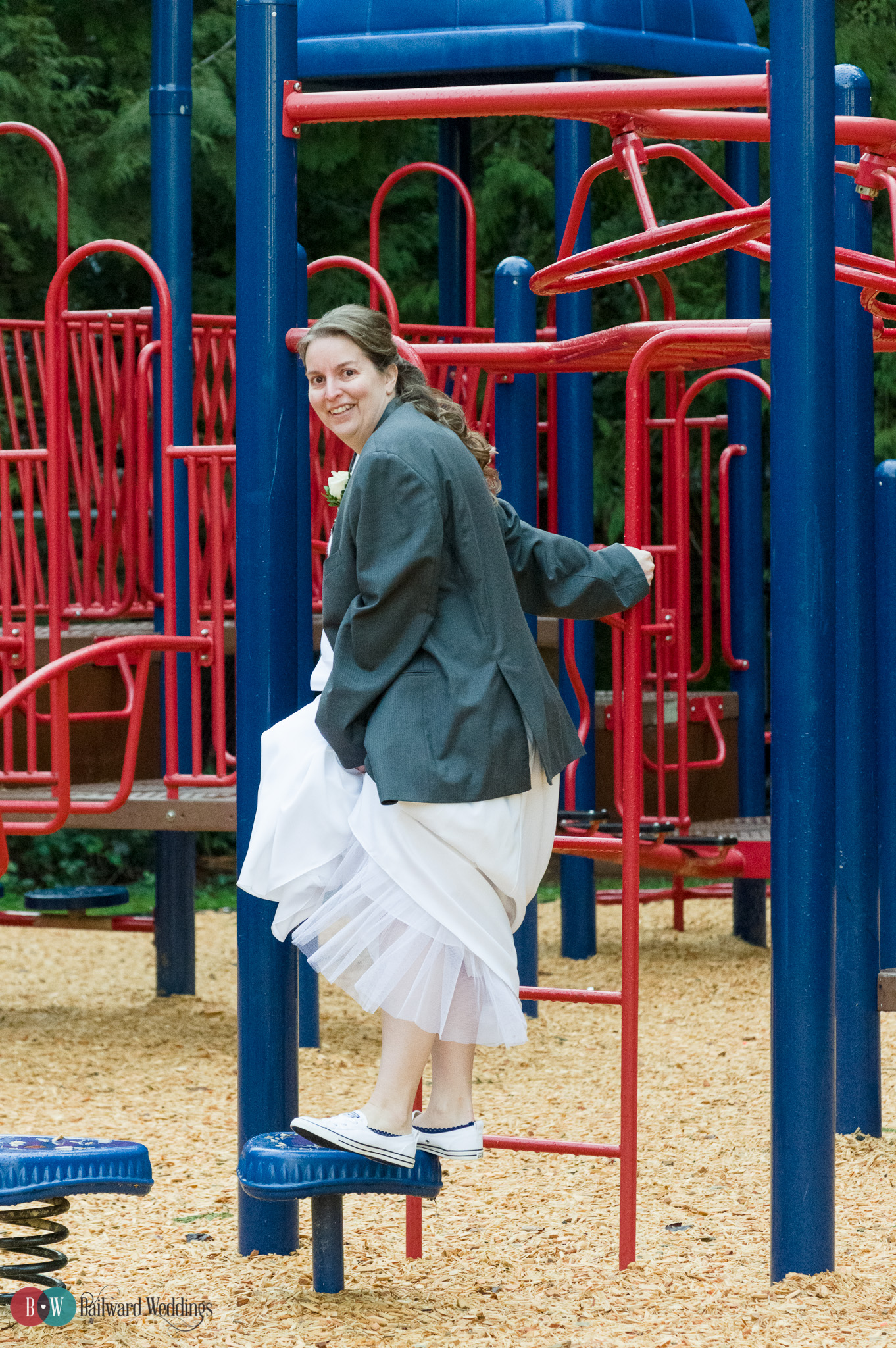 Bride playing on playground