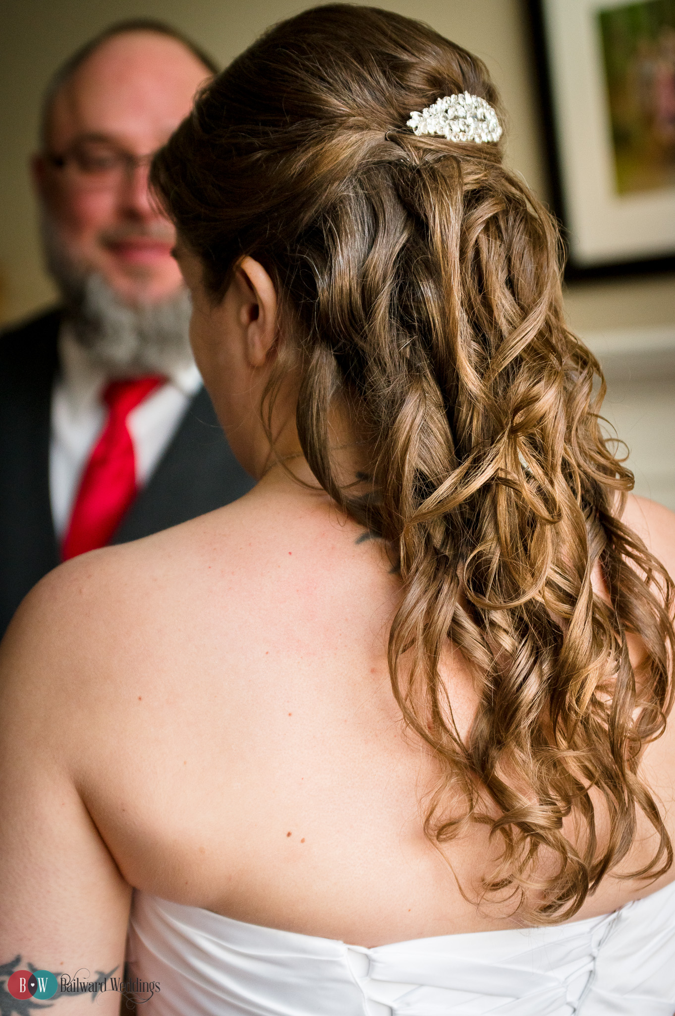 Groom looking at bride.